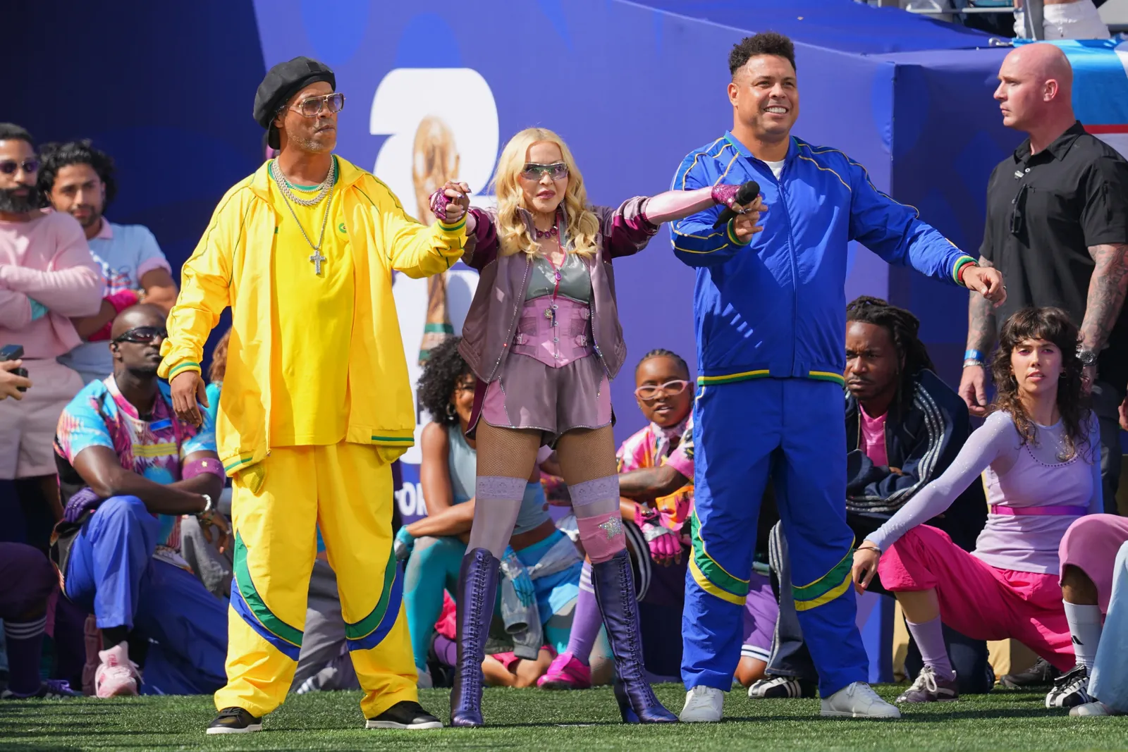 Ronaldinho, left, and Ronaldo stand with Madonna as she performs during the halftime show in the World Cup final soccer match between Spain and Argentina in East Rutherford, N.J., near New York, Sunday, July 19, 2026. (AP Photo/Julio Cortez)