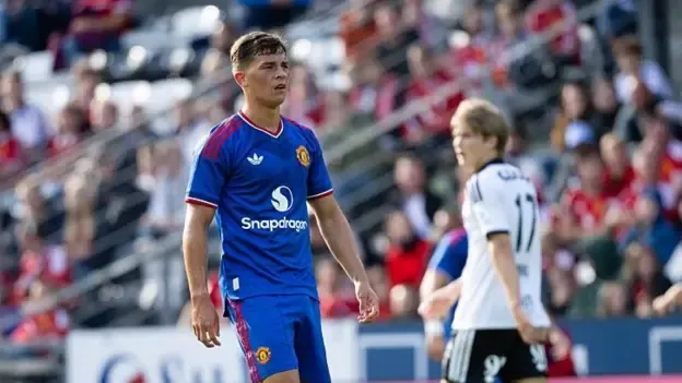 Manchester United forward Shea Lacey wears the club's blue kit in the friendly against Rosenborg