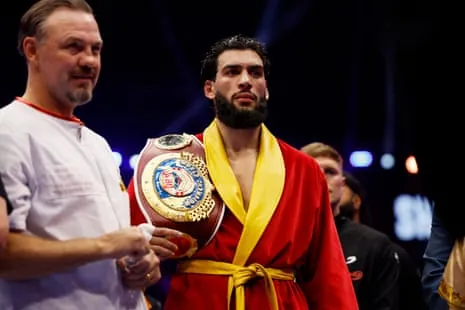 Hamzah Sheeraz with his world title belt and his trainer, Andy Lee.